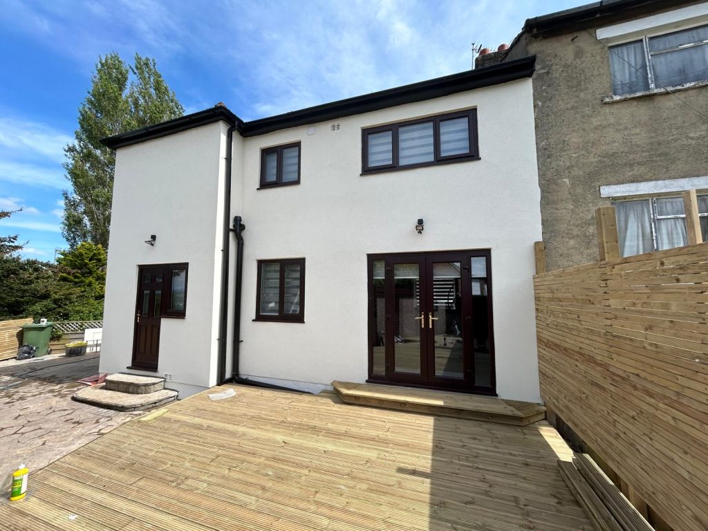 White silicone K-rend finish on two-storey home with external wall insulation in Leeds, West Yorkshire